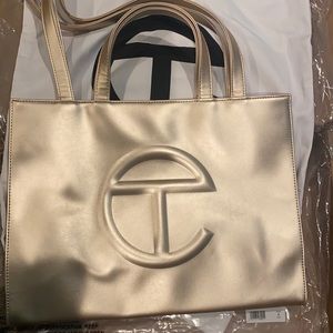 Never used! Still in the bag! NWT!! Telfar medium shopping  bag!! GOLD!!